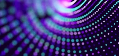 blue and purple dots in concentric circles on a black background