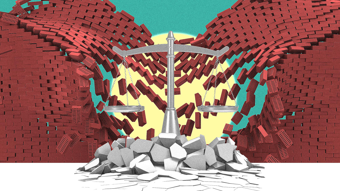 image of balancing scales in front of a crumbling brick wall