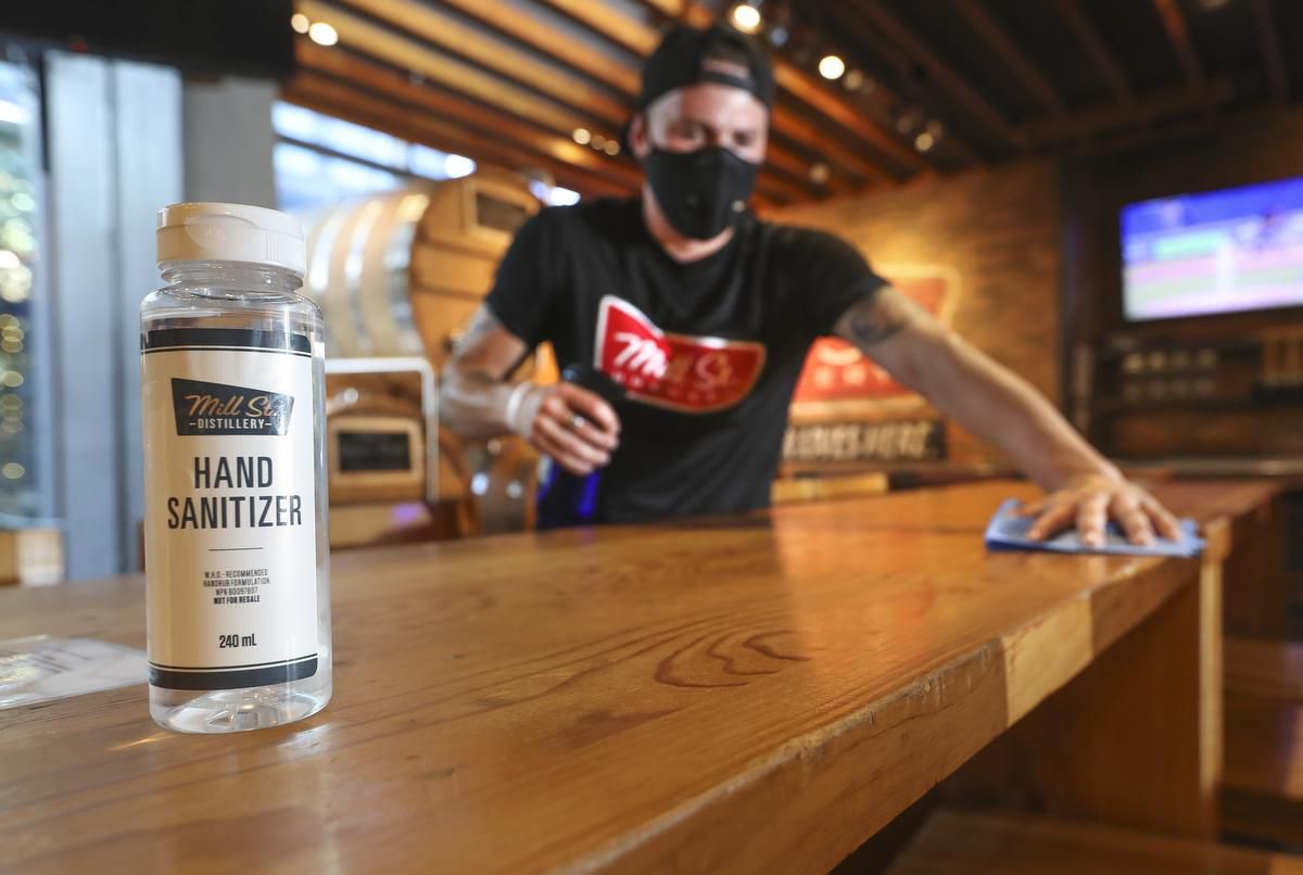 hand sanitizer made by a liquor company sitting on a bar