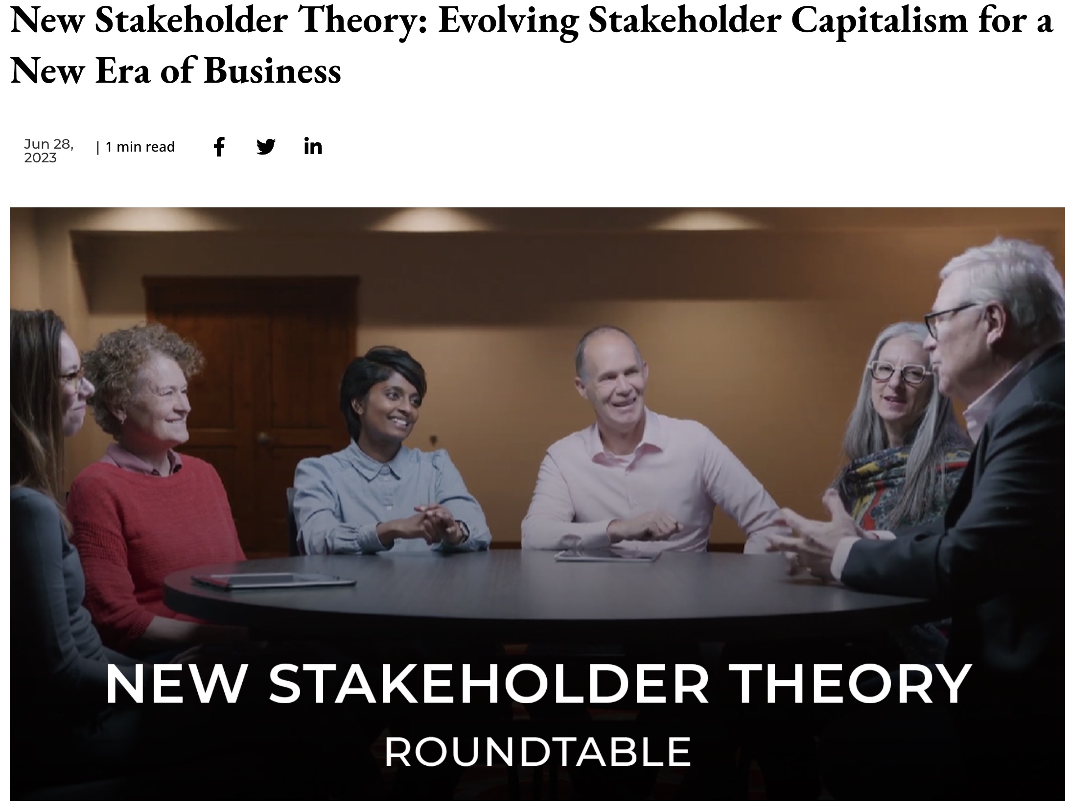 6 people talking at a conference table